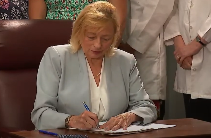 Maine's Democrat Gov. Janet Mills signs LD 1619, 'an act to improve Maine's reproductive privacy laws,' into law, July 19, 2023.