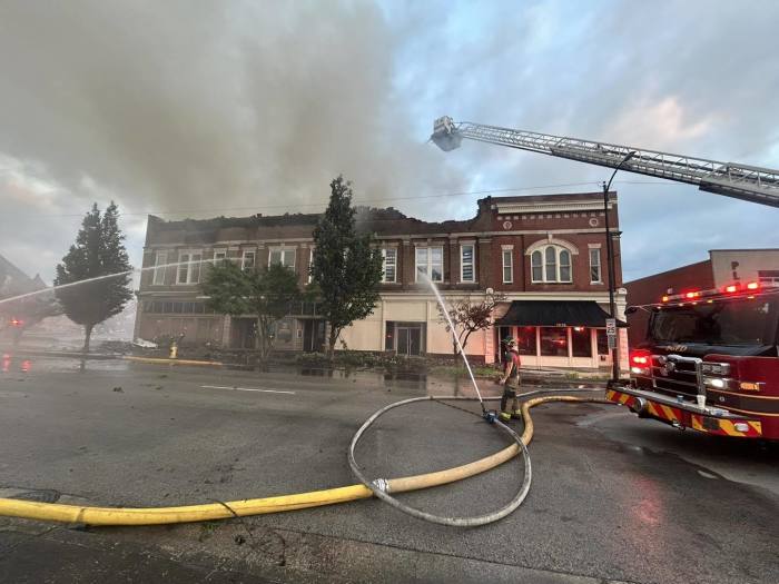 Firefighters battle a fire in downtown Bowling Green, Kentucky, that impacted the local office of U.S. Sen. Rand Paul, R-Ky., on Saturday, July 22, 2023. 