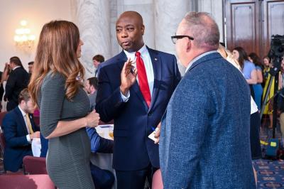 Rep. Nancy Mace, R-S.C. (L), and GOP presidential candidate, Tim Scott (C) speaks with their pastor, Greg Surratt (R) at the 13th Annual South Carolina Prayer Breakfast held in Washington DC on July 26, 2023.