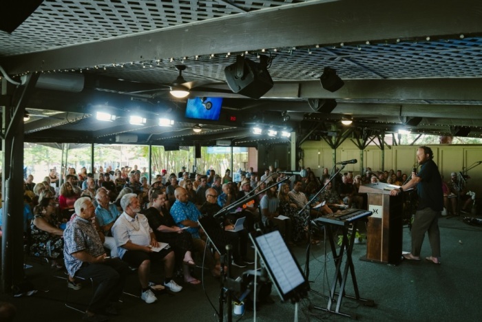 A worship gathering held at Kumulani Chapel in Maui, a congregation affiliated with Harvest Christian Fellowship in California. 