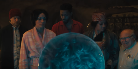 Madame Leota (center) speaks from beyond the grave in "Haunted Mansion."