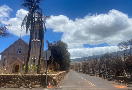 Burned houses are seen adjacent of Maria Lanakila Catholic Church, on Waine street, in the aftermath of a wildfire in Lahaina, western Maui, Hawaii on August 11, 2023. A wildfire that left Lahaina in charred ruins has killed at least 99 people, authorities said, making it one of the deadliest disasters in the U.S. state's history. Brushfires on Maui, fueled by high winds from Hurricane Dora passing to the south of Hawaii, broke out August 8 and rapidly engulfed Lahaina.