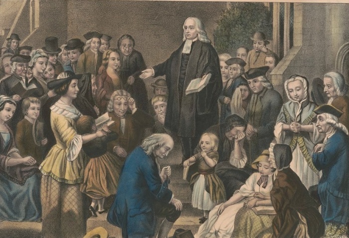 Methodism founder John Wesley preaching at a church yard in Epworth, England in 1742. 
