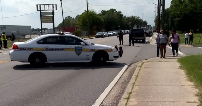 A police car sits near the Doller General store where a gunman killed three people before killing himself on Aug. 26, 2023, in Jacksonville, Florida. 