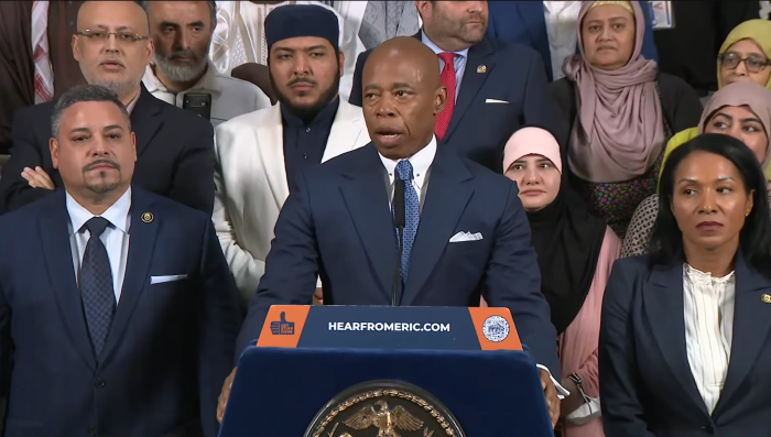 New York City Mayor Eric Adams (podium) announces that mosques can now publicly broadcast the Adhan, the Islamic call to prayer, without a permit.