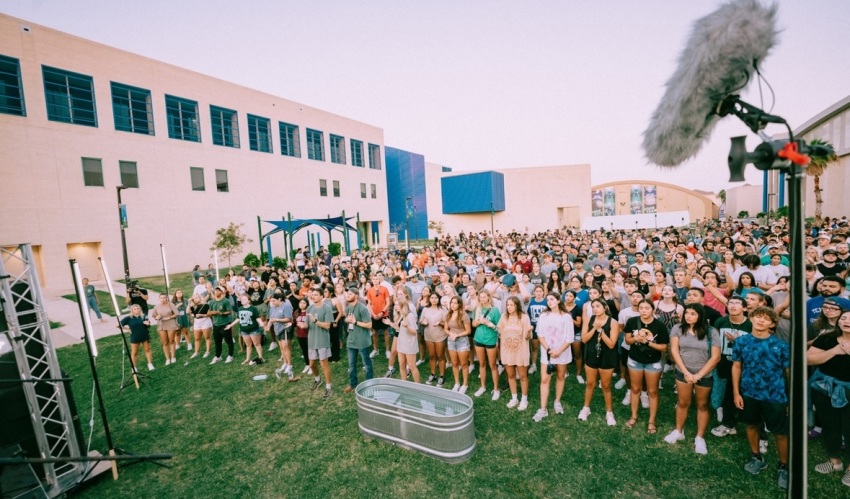 A crowd of students gather at the campus of Texas A&M Corpus Christi on Aug. 31, 2023 for a revival event known as "One Night," which was organized by the Christian student group New Life Young Adults. 