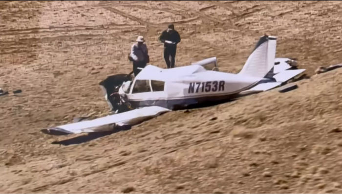 Investigators examine the crashed single-engine Piper Cherokee PA-28140 aircraft in which North Dakota State Senator Doug Larsen, his wife, Amy, and their two young sons died in Grand County, Utah, on Oct. 1, 2023. 