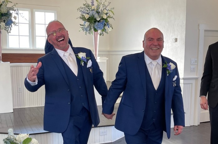 Southern Baptist churchgoer Joe Mills (L) of Orlando, Florida, says he wed his longtime same-sex partner, Mario (R) on December 4, 2021, to protect their finances.