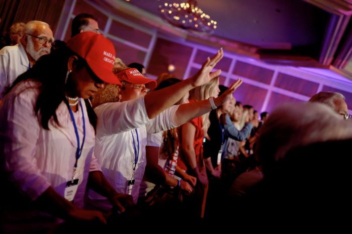 Attendees pray and sing during a live music performance at the Pray Vote Stand Summit at the Omni Shoreham Hotel on September 15, 2023, in Washington, DC. The summit featured remarks from multiple 2024 Republican Presidential candidates making their case to the conservative audience members.