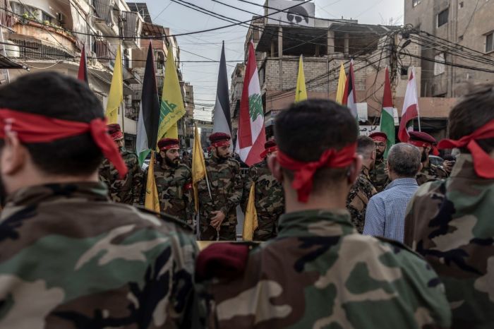Hezbollah supporters in military clothes in formation within the area where the coffin will be honored moments before the beginning of the funeral of a Hezbollah militant killed by IDF in the Dahieh district of Beirut, Lebanon, on Oct. 23, 2023. Lebanese Hezbollah announced the death of 10 militants this week, bringing to 25 the number killed in its ranks since the large-scale Hamas attack in Israel on Oct. 7. 
