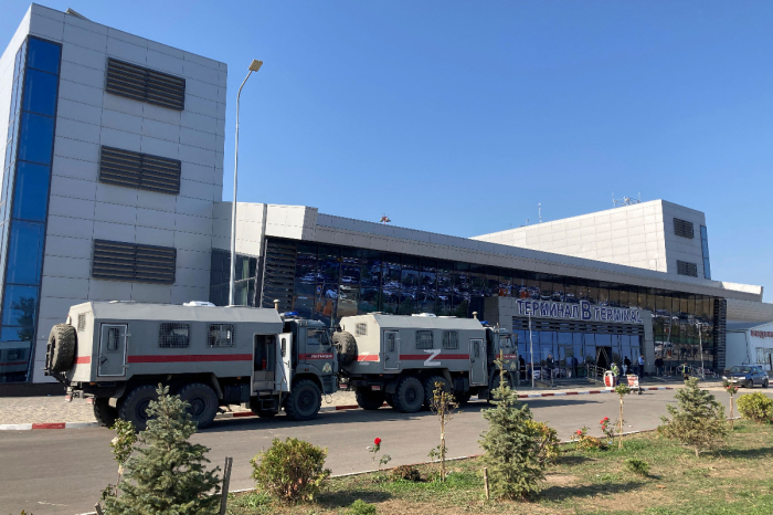 Law enforcement officers patrol an area outside the airport in Makhachkala on October 30, 2023. Russian police on October 30, 2023, said they had arrested 60 people suspected of storming an airport in the Muslim-majority Caucasus republic of Dagestan, seeking to attack Jewish passengers coming from Israel. 
