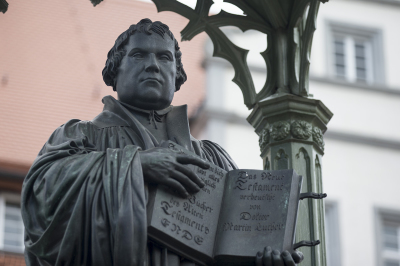 A monument shows Martin Luther on May 20, 2017, in Wittenberg, Germany. Wittenberg and Berlin are hosting a church congress next week to celebrate the 500th anniversary of the Reformation that is expected to draw 200,000 visitors and will include an outdoor church service at Wittenberg. In 1517 Martin Luther nailed his 95 theses to a church door in Wittenberg, sparking the Reformation movement that led to the creation of Protestant denominations all over the world as well as history's most significant challenge to the hegemony of the Catholic Church in the Christian faith. 