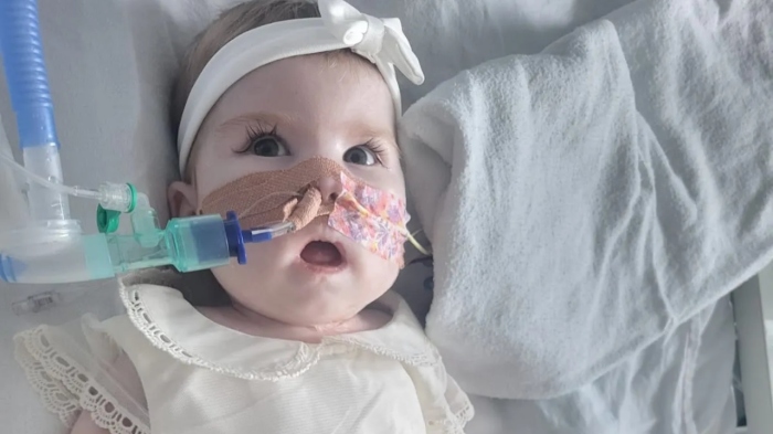8-month-old Indi Gregory, pictured here on the day of her baptism on Sept. 22, has been fighting for her life in pediatric intensive care at the Queen's Medical Centre in Nottingham.
