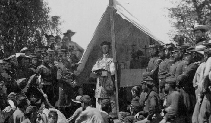 Father Thomas H. Mooney, chaplain of the 69th Infantry Regiment of the New York State Militia and Irish American soldiers at a Catholic Mass at Fort Cocoran, Arlington Heights, Virginia, on June 1, 1861.