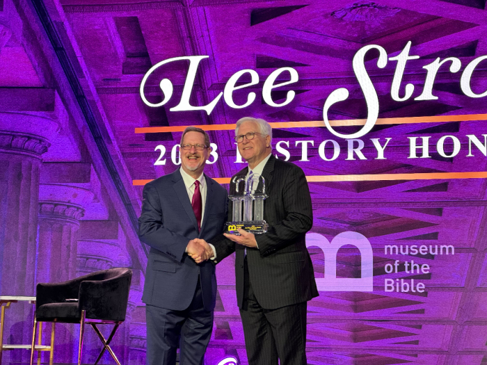 Lee Strobel (left) accepts the Pillar Award for history at the Museum of the Bible in Washington, D.C., November 11, 2023. 