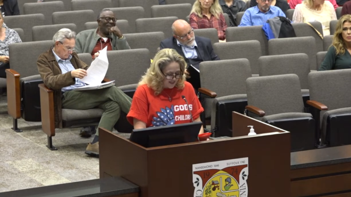 Angela Kilgore (podium) addresses the Suffolk Public Schools Board during a meeting on November 9, 2023.