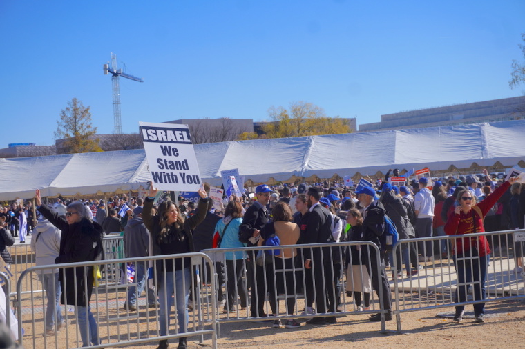 A demonstrator at the Americans March for Israel event holds a poster among other demonstrators in support of the effort to combat antisemitism in Washington D.C. on Nov. 14, 2023.