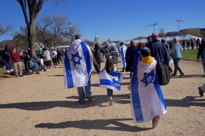 A few demonstrators at the Americans March for Israel event wrapped themselves in Israel flags among other demonstrators in support of the effort to combat antisemitism in Washington D.C. on Nov. 14, 2023.