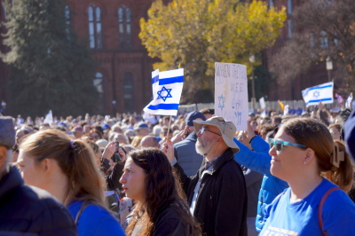 A demonstrator at the Americans March for Israel event holds an Israel flag among other demonstrators in support of the effort to combat antisemitism in Washington D.C. on Nov. 14, 2023.