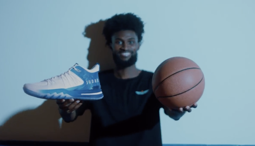 Christian NBA player Jonathan Isaac poses with shoes from his UNITUS JUDAH 1 sneaker line in a promotional video posted on Nov. 16, 2023.