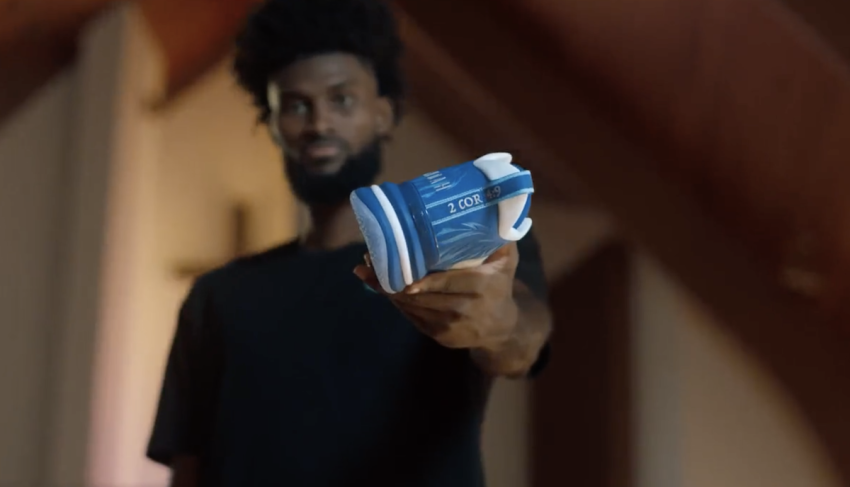 Christian NBA player Jonathan Isaac poses with shoes from his UNITUS JUDAH 1 sneaker line in a promotional video.