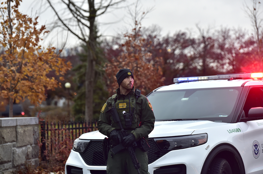 A member of the Border Patrol stands guard as Homeland Security, Border Patrol, and local authorities block traffic to the Rainbow Bridge, one of four major crossings into the U.S. from Canada that is closed after a car crashed and exploded at the bridge on November 22, 2023, in Niagara Falls, New York. According to reports, the two occupants died when their car crashed near a border checkpoint. The cause of the crash is still under investigation.