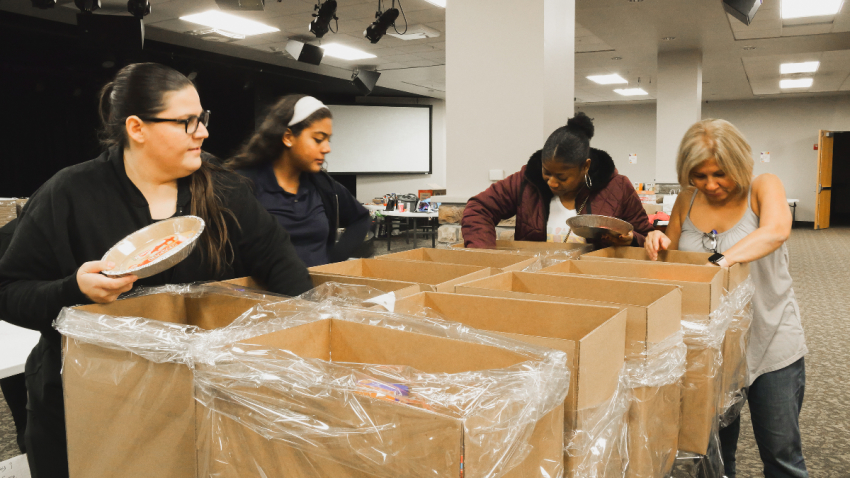 Volunteers at The Life Christian Church in West Orange, New Jersey compile food baskets for families in need ahead of Thanksgiving 2023.