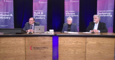 Attendees participate in a special session of the Michigan Conference of the United Methodist Church, held Thursday, Nov. 30, 2023. From left to right: Michigan Bishop David Bard, the Rev. Carolin Spragg and Brad Bartelmay.