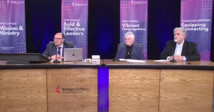 Attendees participate in a special session of the Michigan Conference of the United Methodist Church, held Thursday, Nov. 30, 2023. From left to right: Michigan Bishop David Bard, the Rev. Carolin Spragg and Brad Bartelmay. 