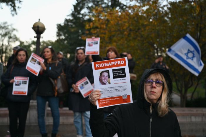 A woman holds a poster of Israeli hostage Omer Neutra during a memorial vigil for the Israeli people killed by Hamas during the October 7 attack in New York City on November 1, 2023. 