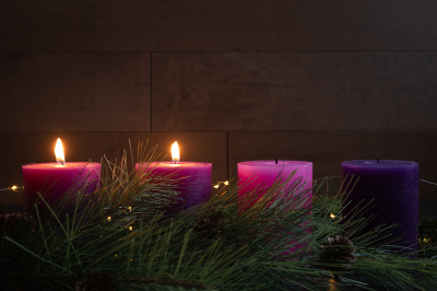Two advent pillar candles burning for the second week of Advent.