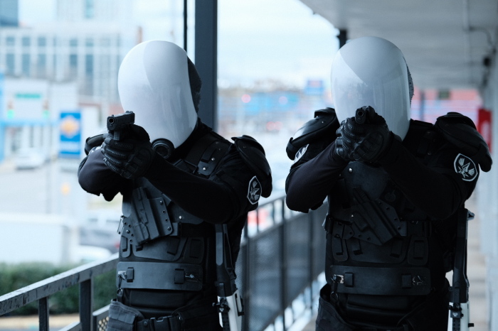 A still of faceless 'stormtrooper' police officers in a dystopian future from 'The Shift.' 