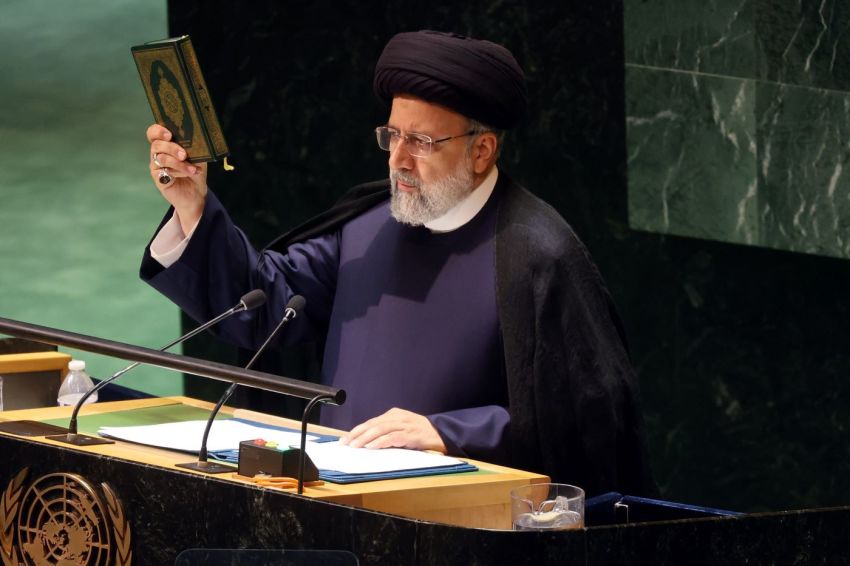 Iran's President Ebrahim Raisi holds the Koran as he address world leaders during the United Nations (UN) General Assembly on September 19, 2023 in New York City. Israel’s Ambassador to the U.N. Gilad Erdan held up a sign stating 'Iranian Women Deserve Freedom Now' and walked along the floor seconds after Raisi entered. Dignitaries and their delegations from across the globe have descended on New York for the annual event. This year marks the 78th session of the General Debate at the UN Headquarters and will focus on the crisis of global warming.
