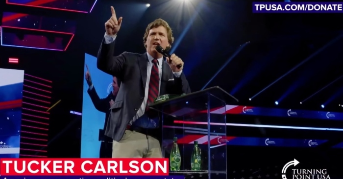 Tucker Carlson delivers an address at Turning Point USA's America Fest 2023 in Phoenix, Ariz., on Dec. 18, 2023.