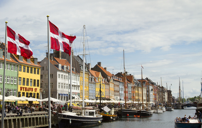 Buildings and ships along the harbor of Nyhavn in Copenhagen, Denmark