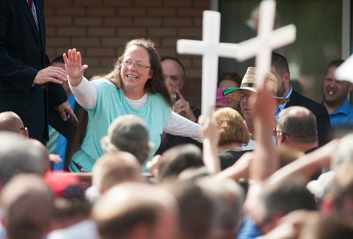 Rowan County Clerk of Courts Kim Davis waves to a crowd of her supporters at a rally in front of the Carter County Detention Center on September 8, 2015, in Grayson, Kentucky. Davis was ordered to jail last week for contempt of court after refusing a court order to issue marriage licenses to same-sex couples. 