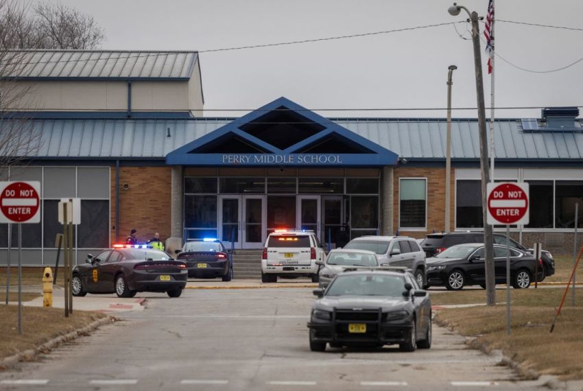 Police officers secure the campus at Perry Middle and High School during a shooting situation in Perry, Iowa, on January 4, 2024. A shooting on Thursday at the high school in Perry left "multiple gunshot victims," local authorities said, adding the incident was over but without confirming if anyone had been killed.