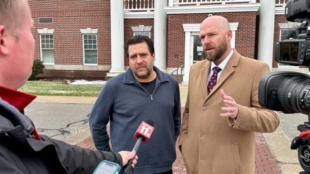 Pastor Chris Avell (L) and his attorney Jeremy Dys (R) speak to reporters outside Bryan Municipal Court in Bryan, Ohio, on Jan. 11, 2023.