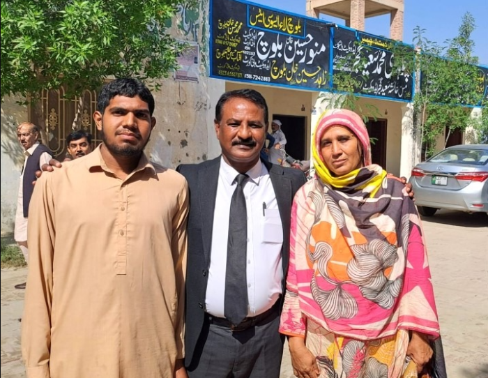 Musarrat Bibi (right) is pictured with attorney Lazar Allah Rakha (center) and Muhammad Sarmad (left) after their acquittal in Pakistan. 