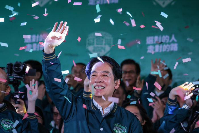 Confetti flies over the stage and crowd as Taiwan's Vice President and presidential-elect from the Democratic Progressive Party (DPP) Lai Ching-te speaks to supporters at a rally at the party's headquarters on January 13, 2024, in Taipei, Taiwan. Taiwan voted in a general election on Jan. 13 that will have direct implications for cross-strait relations. 