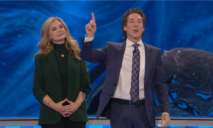 The moment that televangelist Joel Osteen (R) announced to congregants at Lakewood Church in Houston, Texas, that the church paid of a $100 million loan they borrowed from Bank of America some 20 years ago. His wife, Victoria, (L) looks on, January 14, 2024. 
