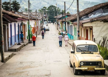 People walk on the street in Salento, Colombia.