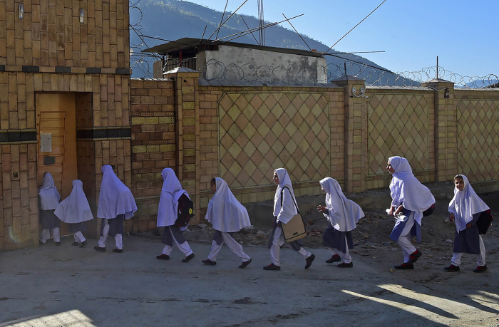 Pakistani students arrive at the Khpal Kor Model School, which was built with Malala Yousafzai's Nobel prize money, in Malala's home district of Shangla in Pakistan's Swat region, on March 30, 2018.