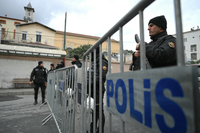 Turkish anti riot police officers block the street of Santa Maria Church after an attack in Istanbul, on January 28, 2024. Two assailants launched an armed attack on an Italian church in Istanbul during a religious ceremony on January 28, 2024, leaving one person dead, Turkey's interior minister said. 