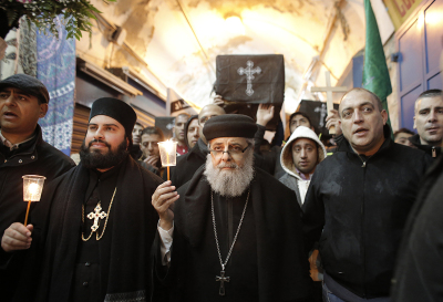 Christians take part in a symbolic funeral procession in Jerusalem's Old City on February 18, 2015, for the 21 Egyptian Coptic Christians beheaded by the Islamic State (IS) group on a Libyan beach. Egypt pushed for action against jihadists in Libya ahead of a U.N. Security Council meeting but faced reluctance from Western powers who stressed the need for a political solution. 