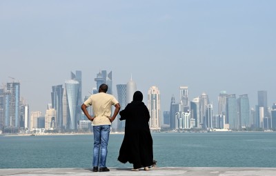 People look at the downtown skyline from the Corniche during the FIFA Arab Cup Qatar on December 15, 2021 in Doha, Qatar. 
