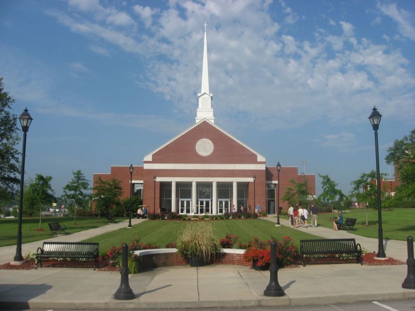 People walk outside Ransdell Chapel at Campbellsville University in Campbellsville, Kentucky.