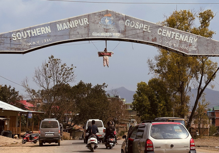At the entrance gate of Manipur's Churachandpur district, an effigy bears the message 'Justice is Dead.'