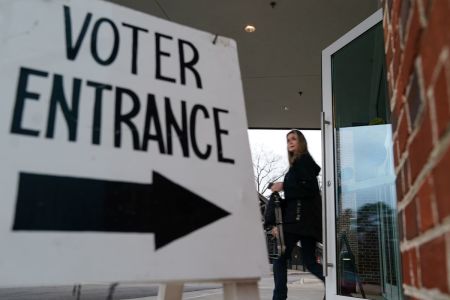 A voter leaves a polling place after casting their ballot in the state's primary on March 5, 2024, in Mountain Brook, Alabama. Fifteen States and one U.S. Territory hold their primary elections on Super Tuesday, awarding more delegates than any other day in the presidential nominating calendar.