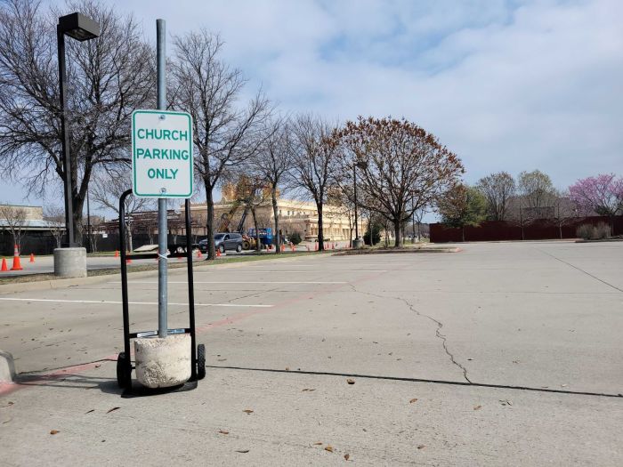The parking lot of Rejoice Lutheran Church in Frisco, Texas, on March 6, 2024. The Hanuman Temple can be seen just behind the trees adjacent to the lot.